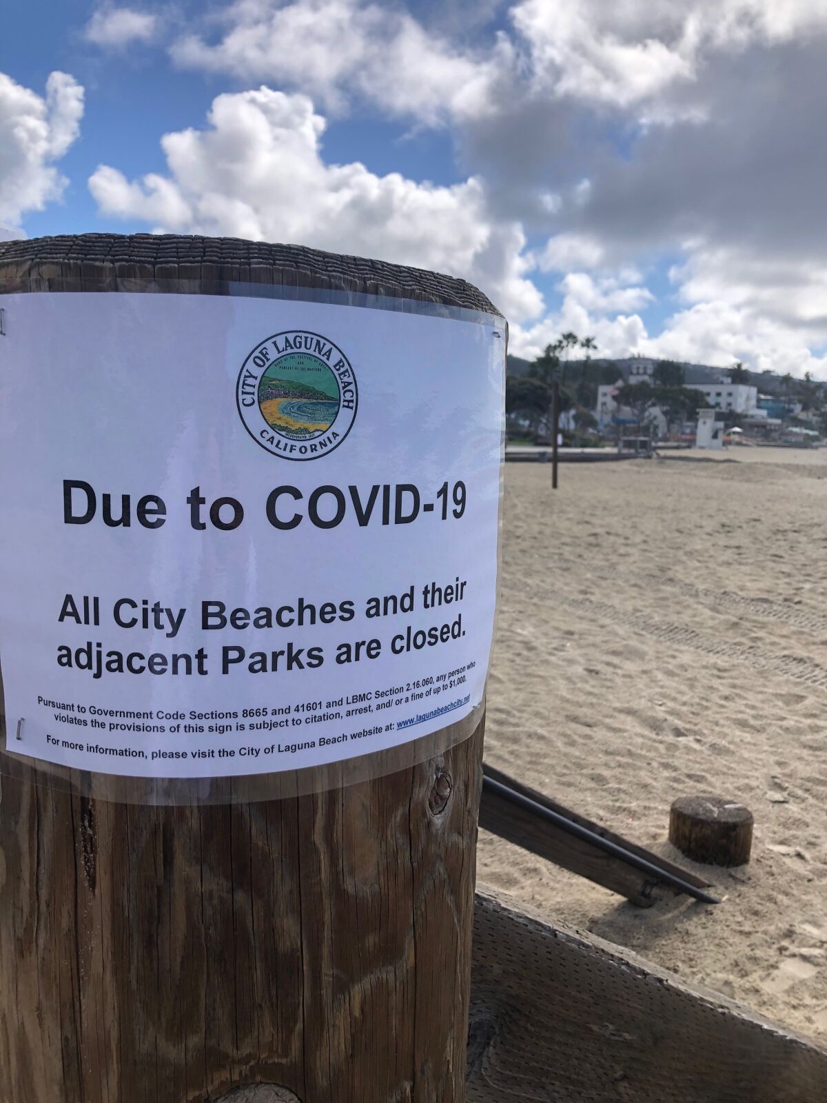 Closure notices went up Monday at all city-run beaches in Laguna Beach, including this one at Main Beach.