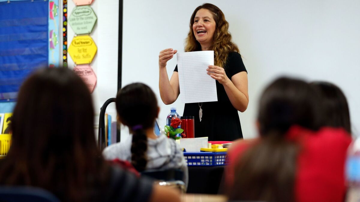 Ingrid Villeda teaches fifth grade students on the topic of health at 93rd Street Elementary School in South Los Angeles.