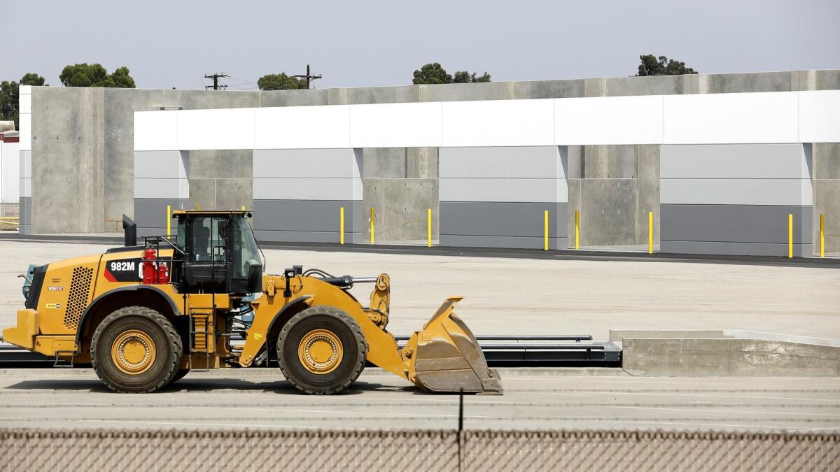 The sparwling 14-acre industrial yard lies just east of the Los Angeles River in the working-class city of Bell.