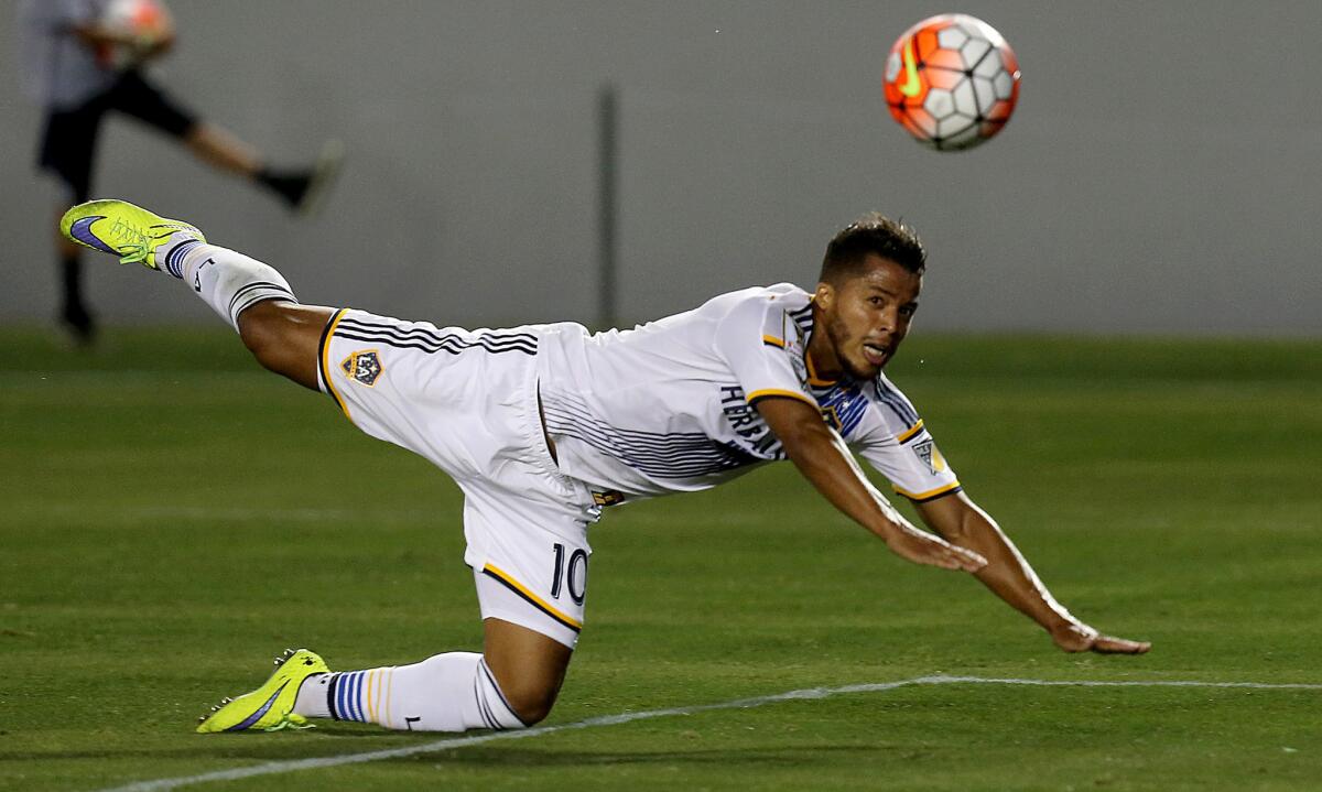 New Galaxy forward Giovani Dos Santos directs a header towards the Central FC goal in the second half during his debut with the team.