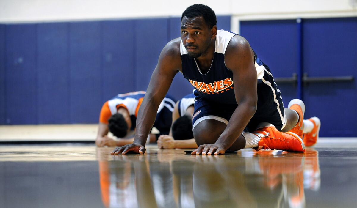 Pepperdine basketball player Stacy Davis stretches before practice at the campus in Malibu on Nov. 17, 2015.