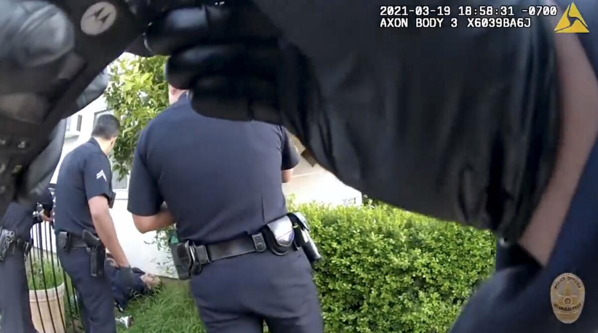 LAPD body cam footage shows Nathan Glover after he was shot by one of the officers chasing him