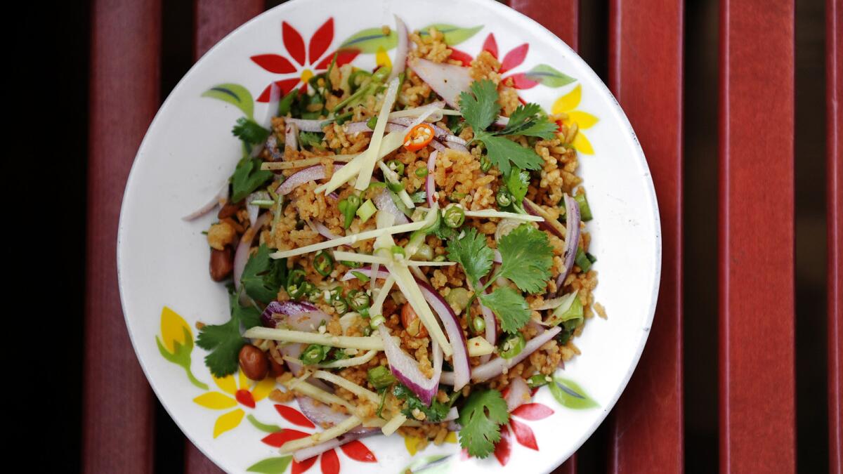 Nam khao tod (crispy rice salad) is a fan favorite at both Night + Market locations. A third Night + Market is scheduled to open in Venice in January.