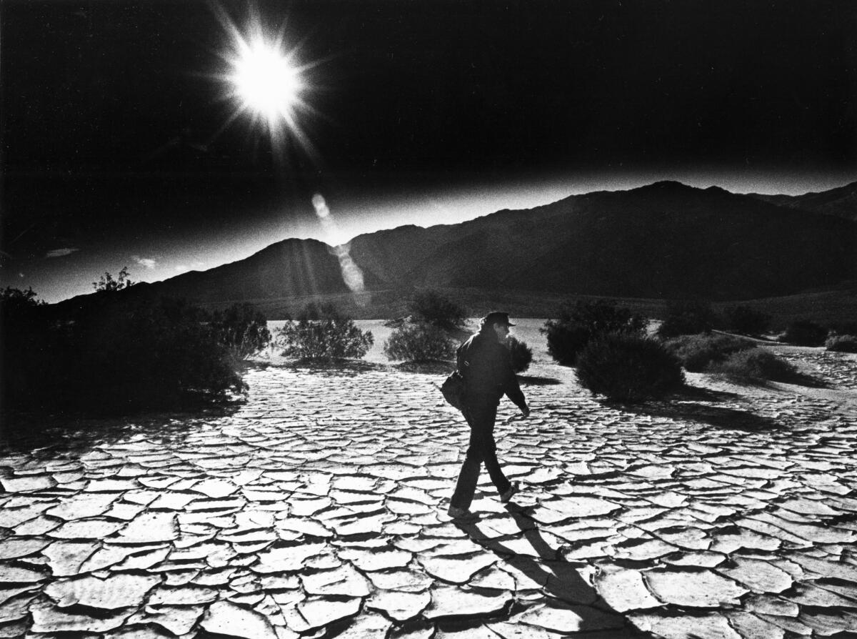 Wilis Warnick of Glendora walks through the Salt Creek River bed next to the Stove Pipe Wells Sand Dunes in Death Valley. Photo dated Feb. 4, 1986 (Howard Lipin)