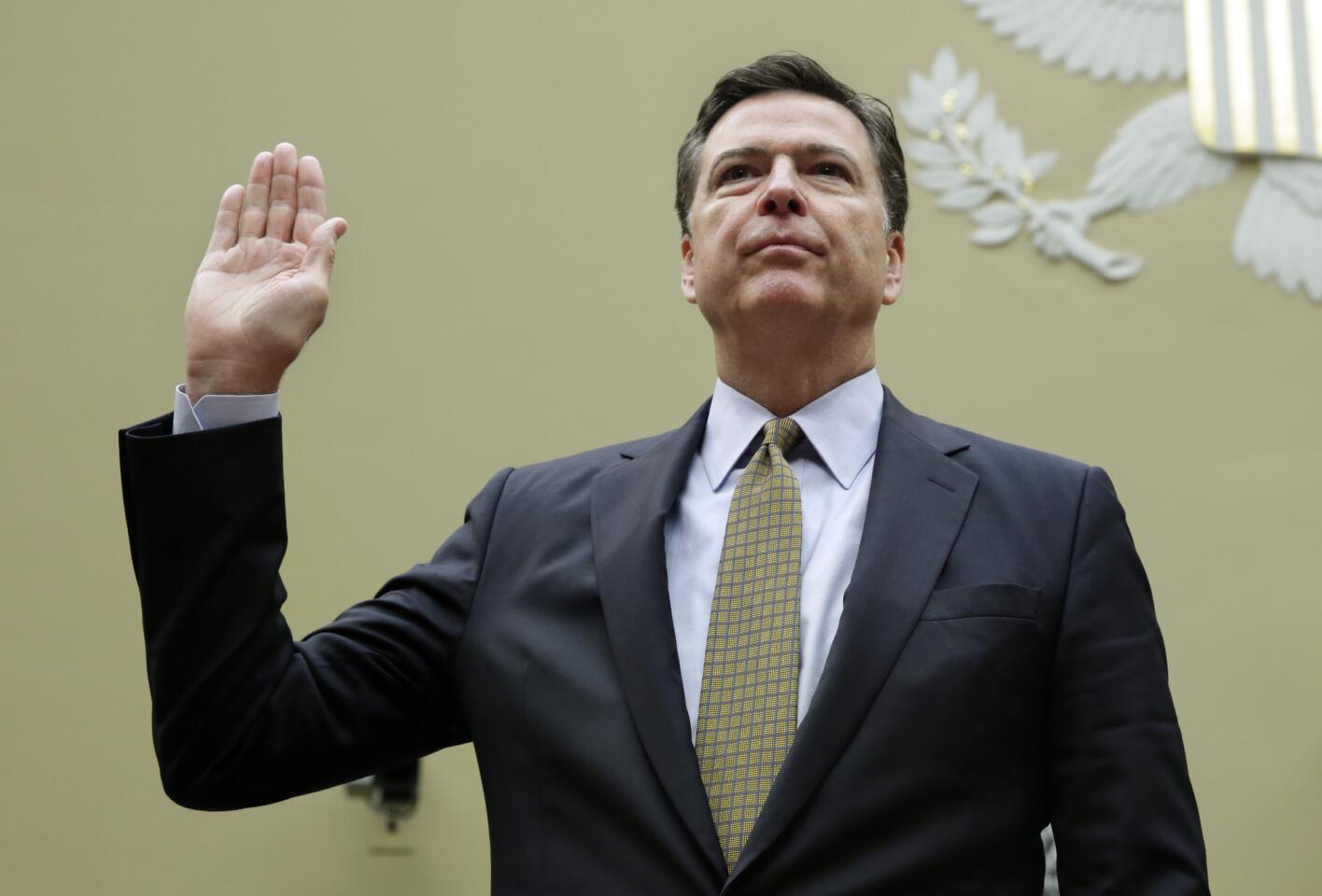 FBI Director James Comey is sworn-in before a House Oversight and Government Reform Committee hearing on Capitol Hill in Washington, DC, on July 7, 2016.