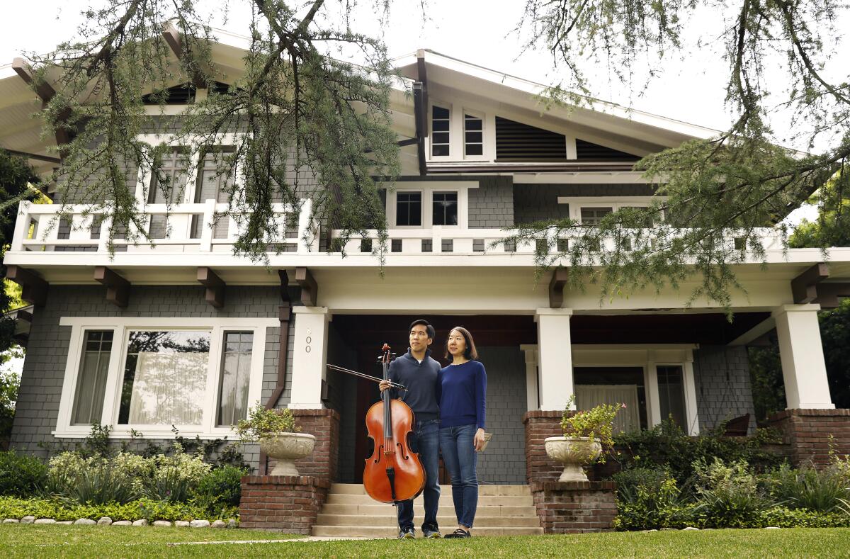 Beong-Soo Kim and Bonnie Wongtrakool in front of their Pasadena home