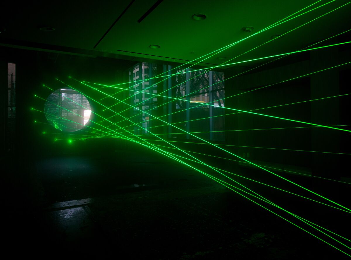 Artist Rita McBride's laser installation, "Particulates."