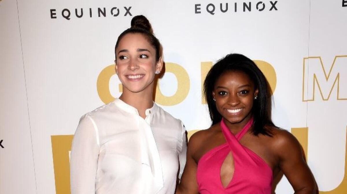 Olympic athletes Aly Raisman, left, and Simone Biles are part of the Gold Meets Golden festivities in West L.A.