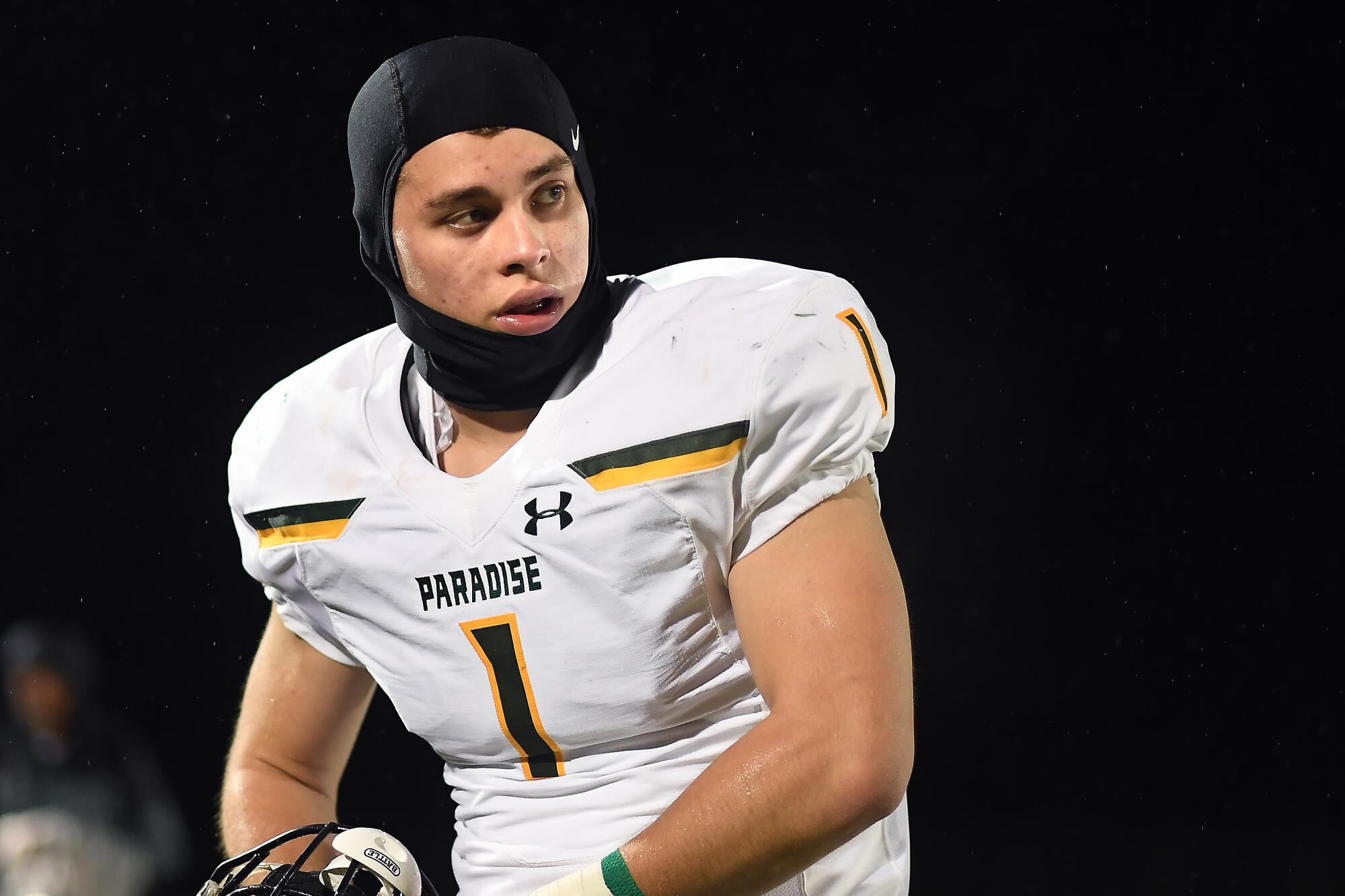 Paradise High School middle linebacker Spencer Kiefer looks over his shoulder during a game.