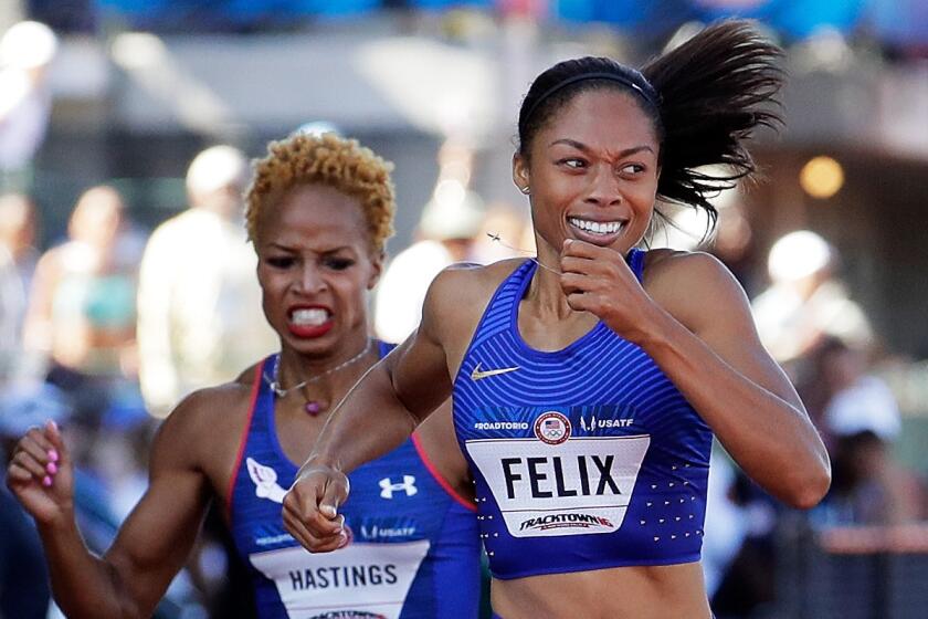 Allyson Felix runs to victory ahead of Natasha Hastings in the Women's 400 Meters Final.