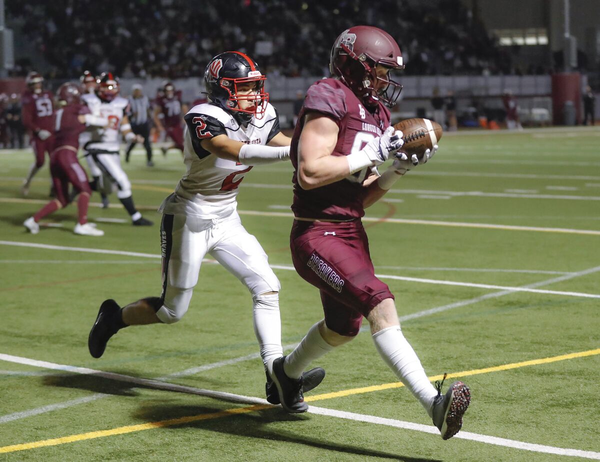 Laguna's Ryner Swanson (87) takes a pass from Jackson Kollock and steps into the end zone for a touchdown.