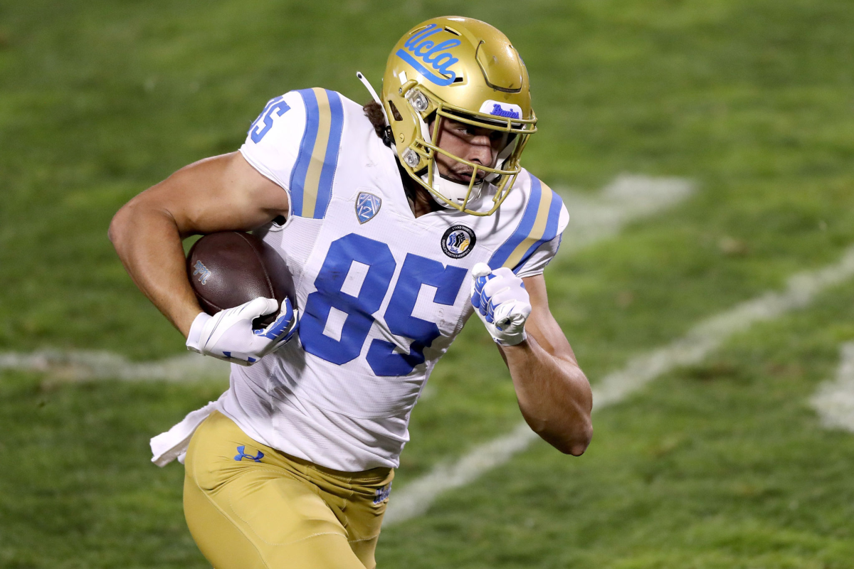 UCLA tight end Greg Dulcich carries the ball on a touchdown reception against Colorado on Nov. 7.