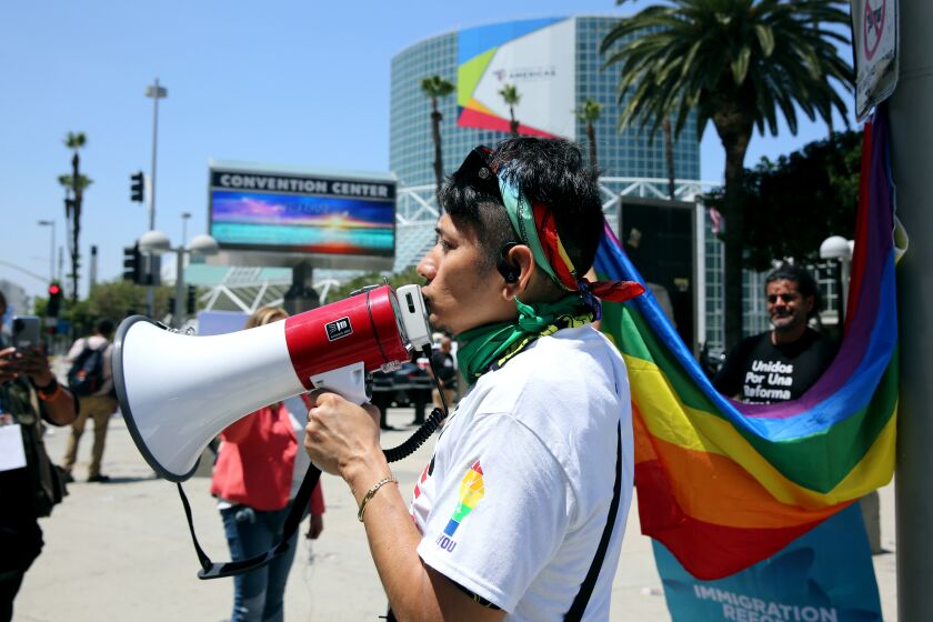 Salvadorian activist Obbi Fenix, 35 of Boston, speaks about immigration reform outside the IX Summit of the Americas, at the Los Angeles Convention Center on Monday, June 6, 2022.
