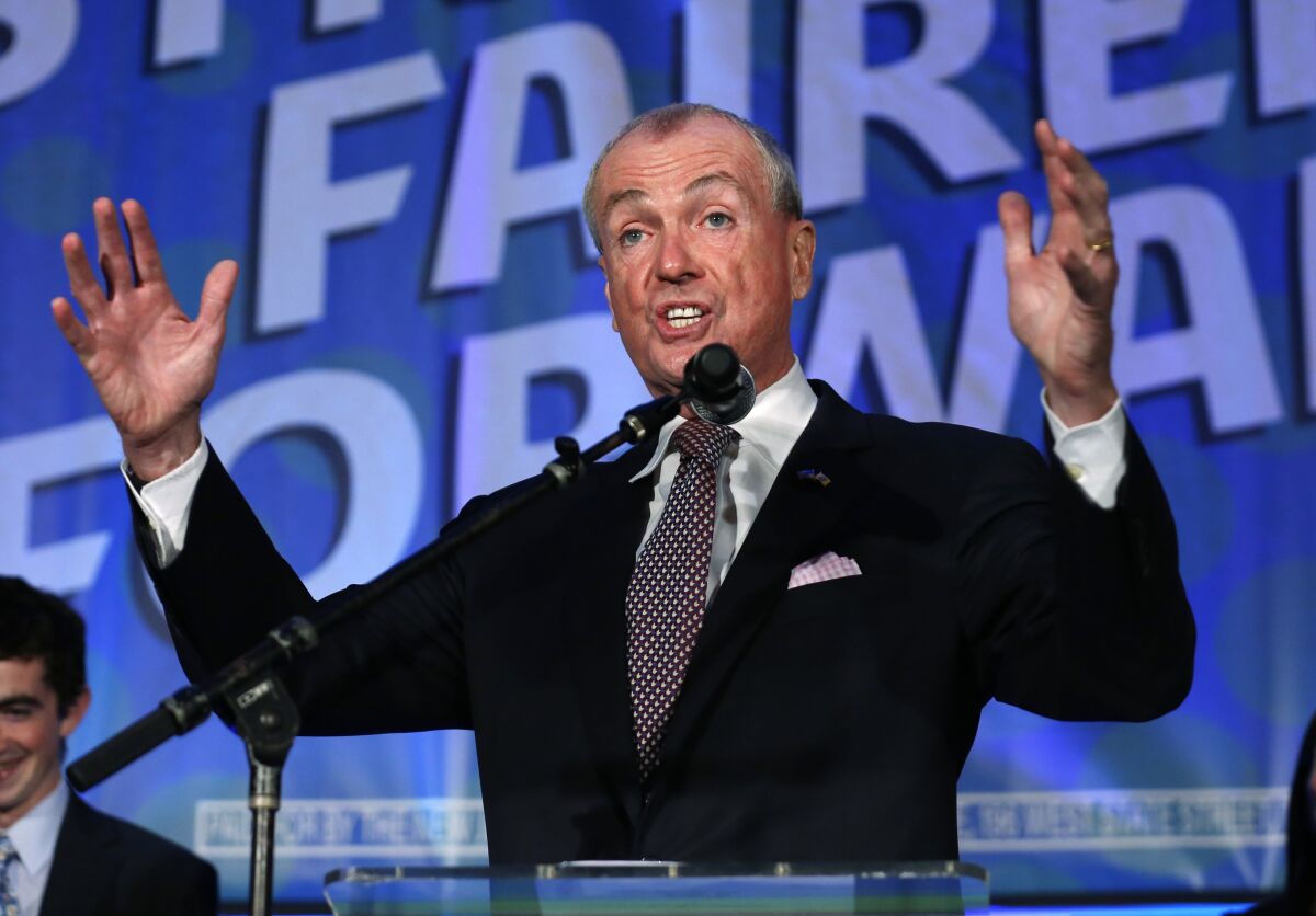 New Jersey Gov. Phil Murphy delivers a victory speech after defeating Republican Jack Ciattarelli to win re-election, Wednesday, Nov. 3, 2021, in Asbury Park, N.J. (AP Photo/Noah K. Murray)