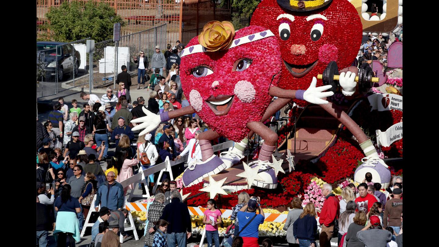 Large crowds photograph and view the American Heart Assn. and Union Bank float from the 127th Tournament of Roses Parade on display through Sunday at Victory Park in Pasadena.