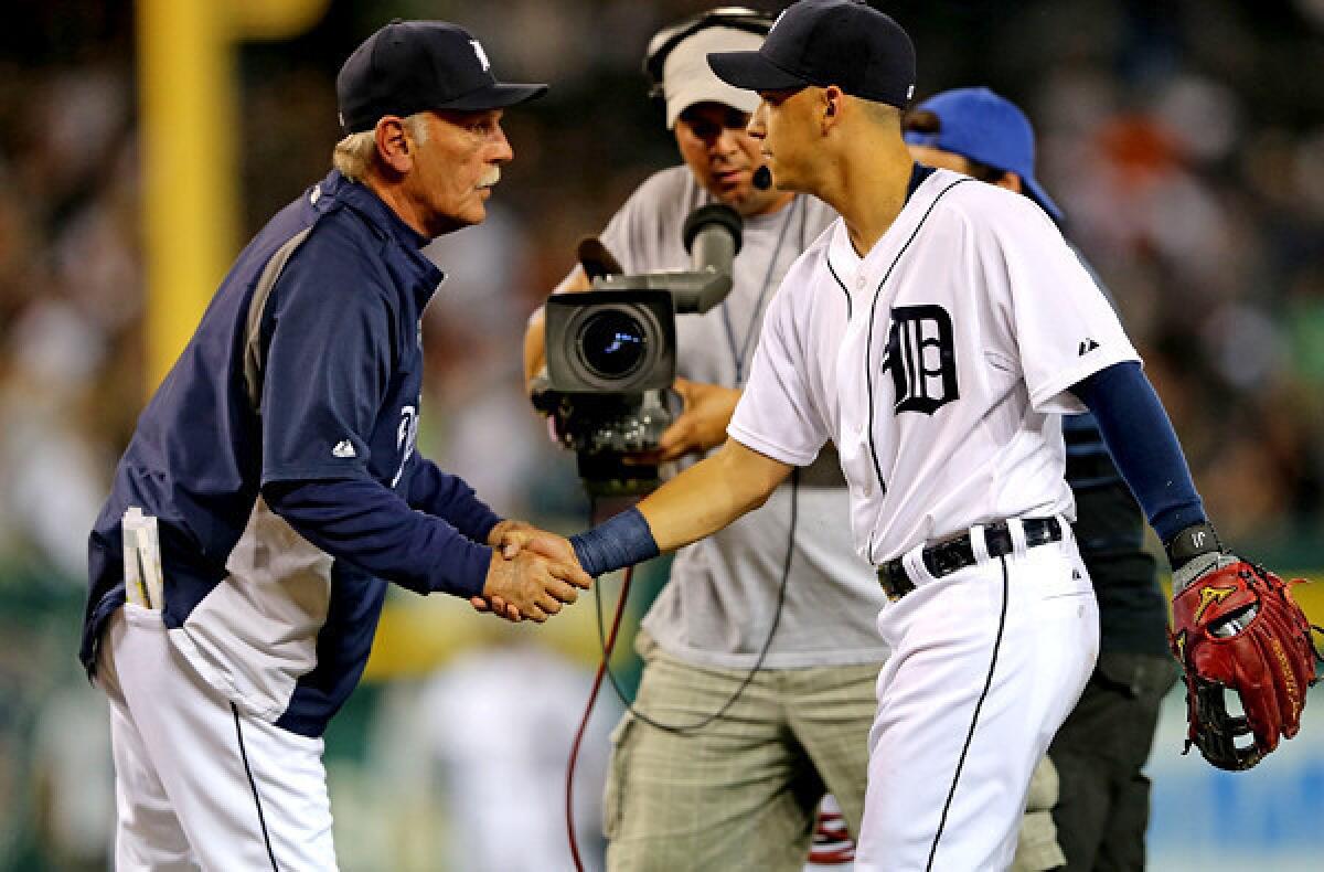 Tigers Manager Jim Leyland celebrates a victory over the Chicago White Sox with recently acquired infielder Jose Iglesias on Friday at Comerica Park in Detroit.