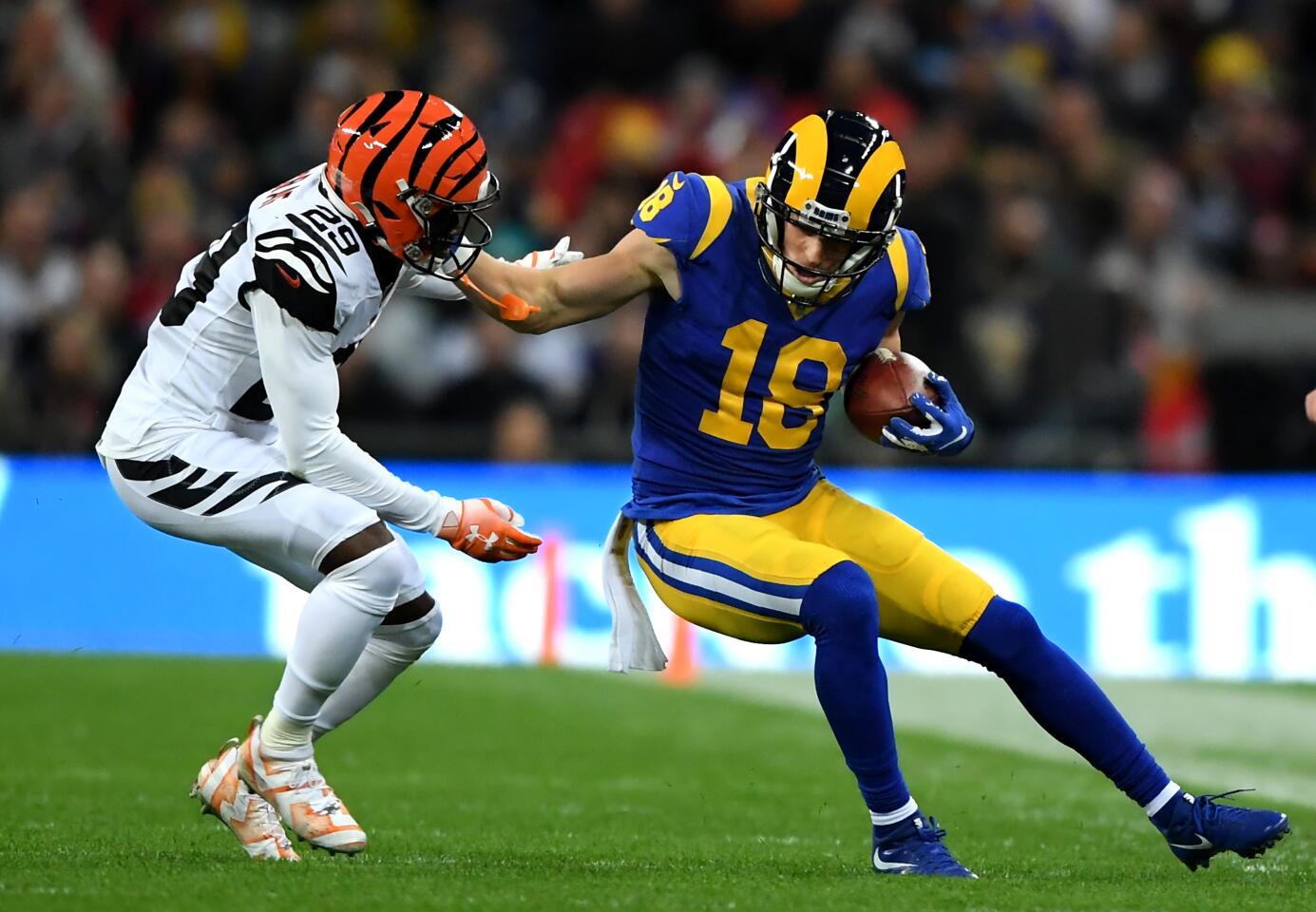 Rams quarterback Jared Goff stiff-arms Bengals cornerback Tony McRae after scrambling from the pocket.