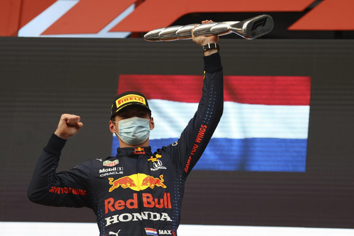 Max Verstappen celebrates on the podium.
