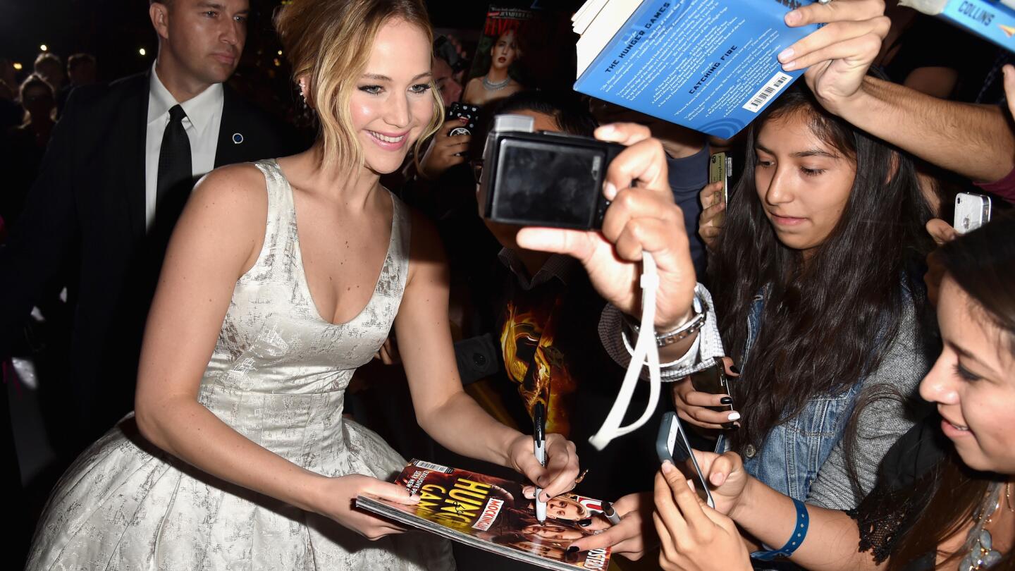 Jennifer Lawrence poses for a selfie with fans at the premiere of "The Hunger Games: Mockingjay -- Part 1" on Nov. 17, 2014, in Los Angeles.