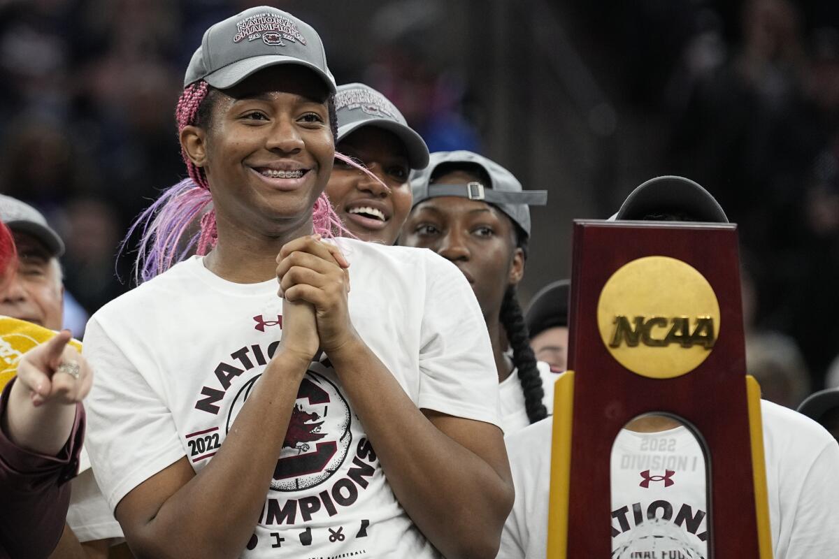 FILE - South Carolina's Aliyah Boston smiles after beating UConn in the Final Four championship game, Sunday, April 3, 2022, in Minneapolis. South Carolina consensus player of the year Aliyah Boston says she turned down a late invite to the ESPYS awards show and was hurt she wasn't asked earlier to attend. (AP Photo/Eric Gay, File)