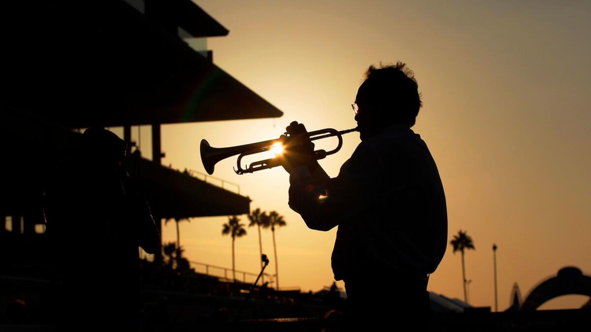 Del Mar racetrack, shown as trumpet player Les Kepics adds a musical bow to the final day of the most recent annual summer meet, will host the Breeders' Cup for the first time Nov. 3-4.