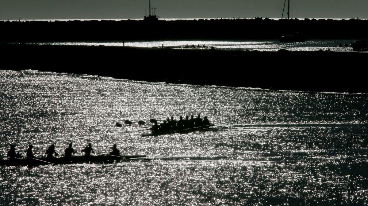 A power boat struck a kayaker in Marina del Rey on Monday, law enforcement said. Above, crews row boats through the marina.