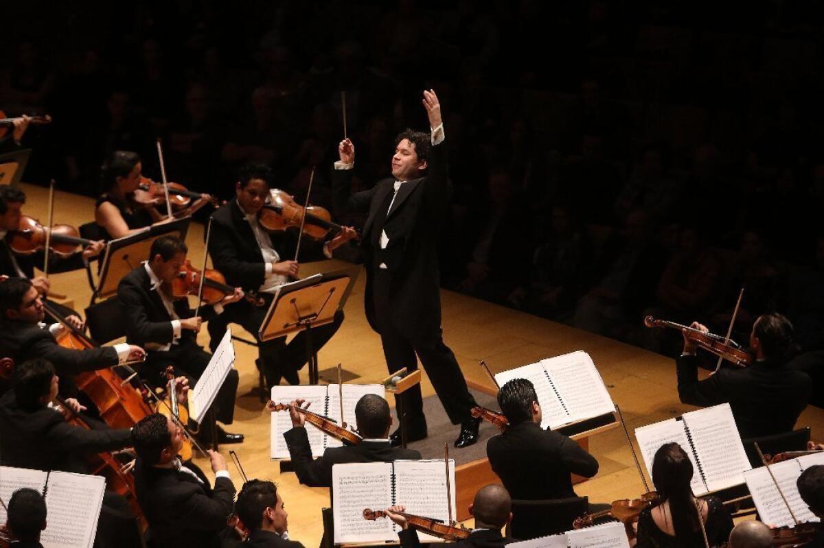 Gustavo Dudamel leads members of the Simon Bolivar Symphony Orchestra of Venezuela last week at Walt Disney Concert Hall in Los Angeles.