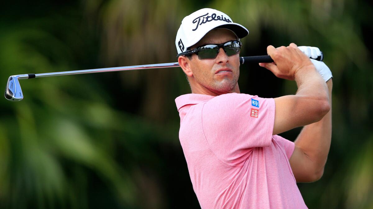 Adam Scott follows through on his tee shot at No. 8 during the second round of hte WGC Cadillac Championship on Friday.