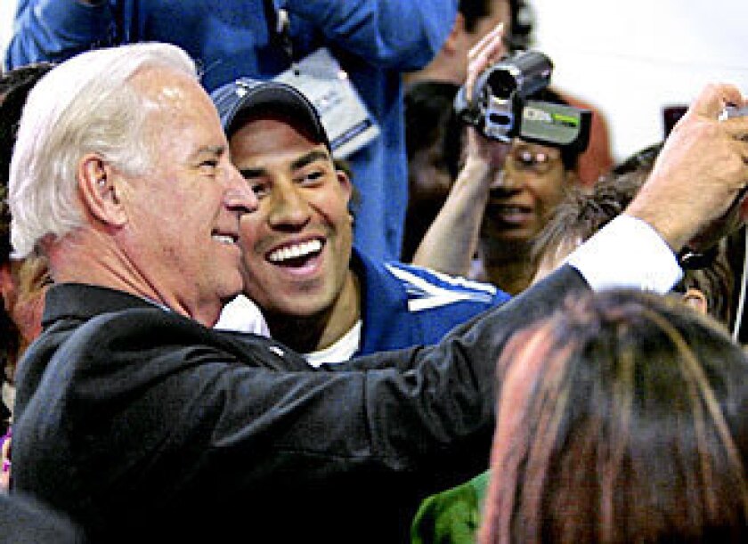 Joe Biden takes a selfie with a supporter in 2008. 