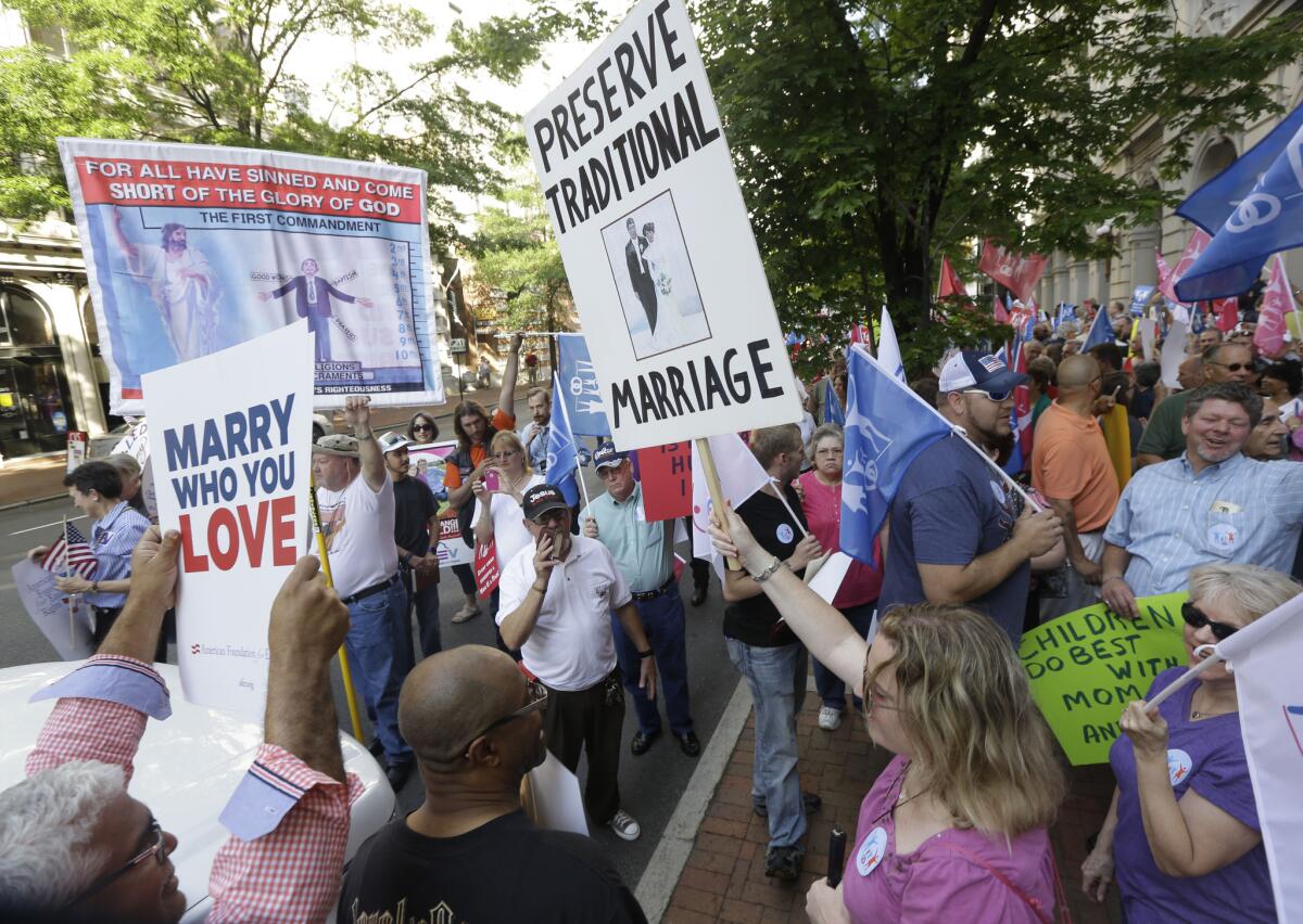 Supporters of traditional marriage and gay marriage demonstrate in Richmond, Va. A federal appeals court refused to block weddings from taking place in the state on Wednesday, meaning couples could begin to wed as early as next week.