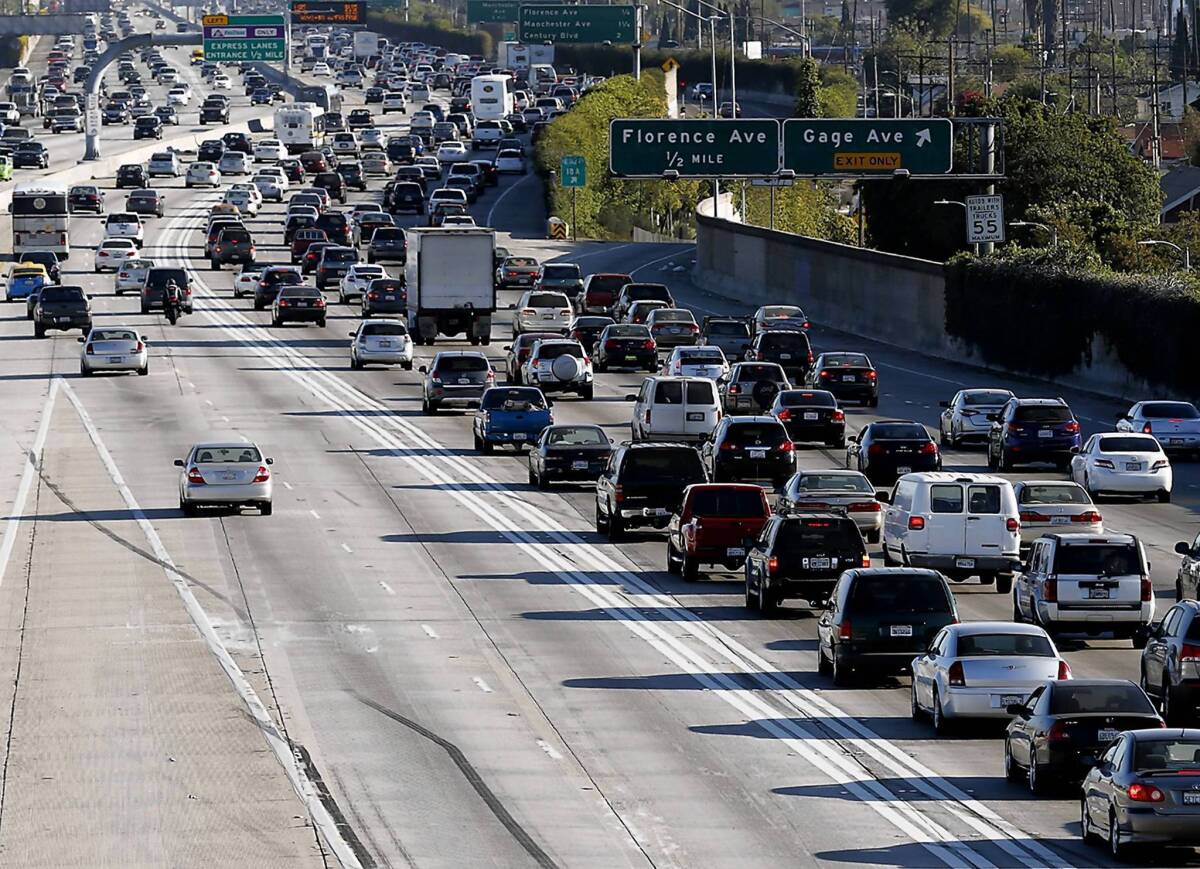 Traffic moves quickly in the 110 toll and carpool lanes as bumper-to-bumper congestion slows down regular traffic.