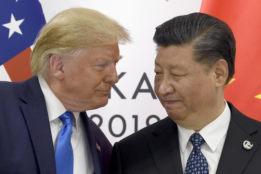 FILE - In this Saturday, June 29, 2019, file photo, U.S. President Donald Trump, left, meets with Chinese President Xi Jinping during a meeting on the sidelines of the G-20 summit in Osaka, Japan. Four decades after the U.S. established diplomatic ties with communist China, the relationship between the two is at a turning point. (AP Photo/Susan Walsh, File)