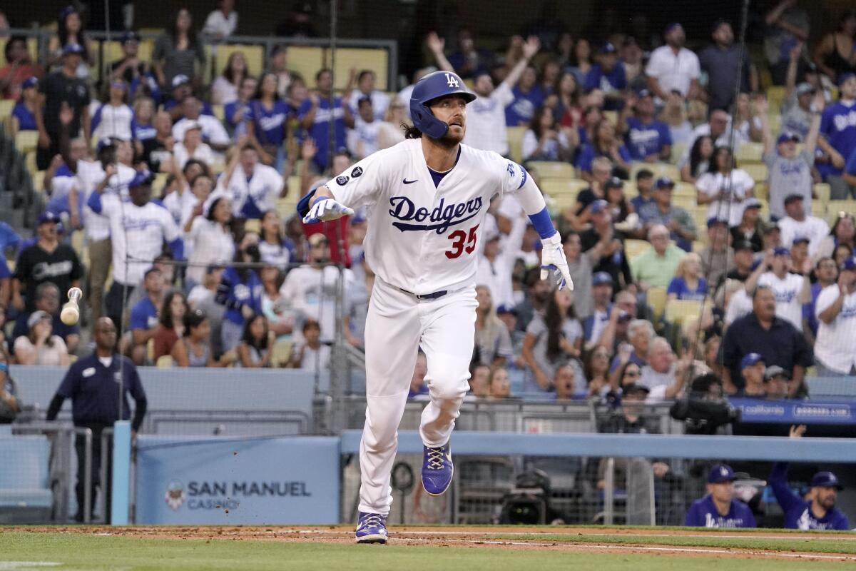 Los Angeles Dodgers' Cody Bellinger drops his bat as he hits a two-run home run during the first inning.
