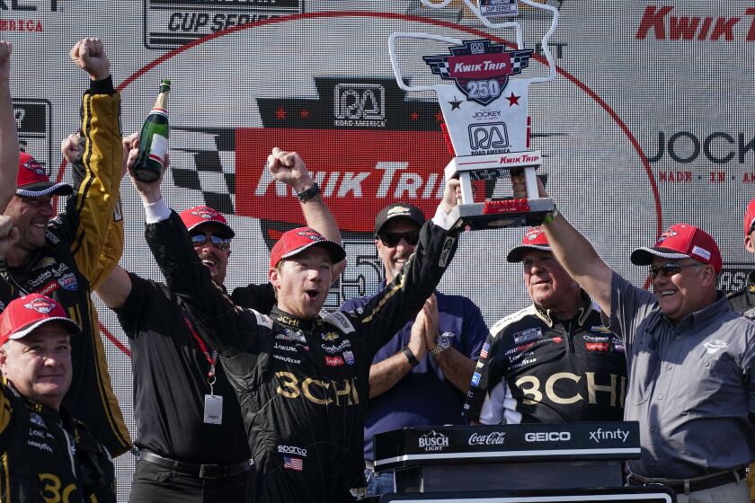 Tyler Reddick reacts after winning the Kwik Trip 250 after a NASCAR Cup Series auto race Sunday, July 3, 2022, at Road America in Elkhart Lake, Wis. (AP Photo/Morry Gash)