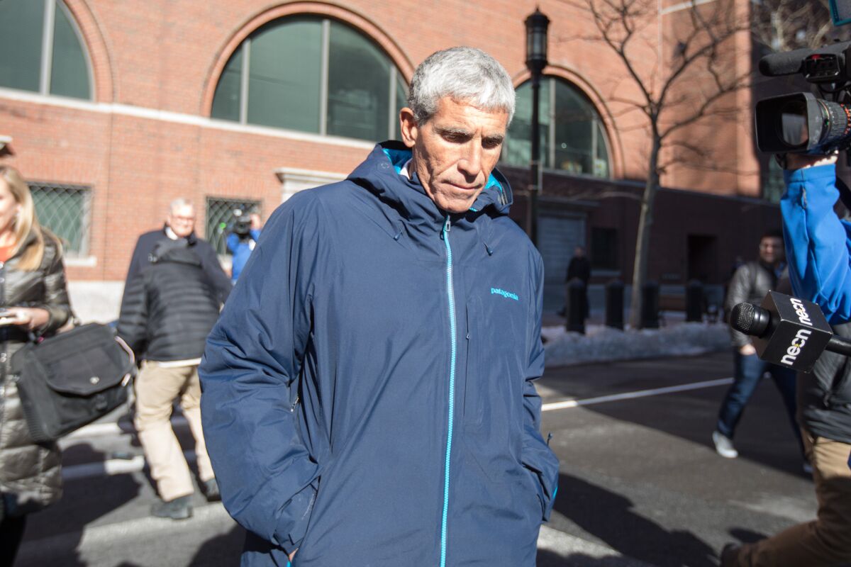 William "Rick" Singer leaves Boston Federal Court in 2019.