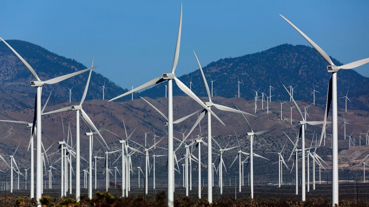 Key to 100% renewable energy? Wind farms such as this installation in the Tehachapi Pass are at the heart of a legal dispute among climate change experts.