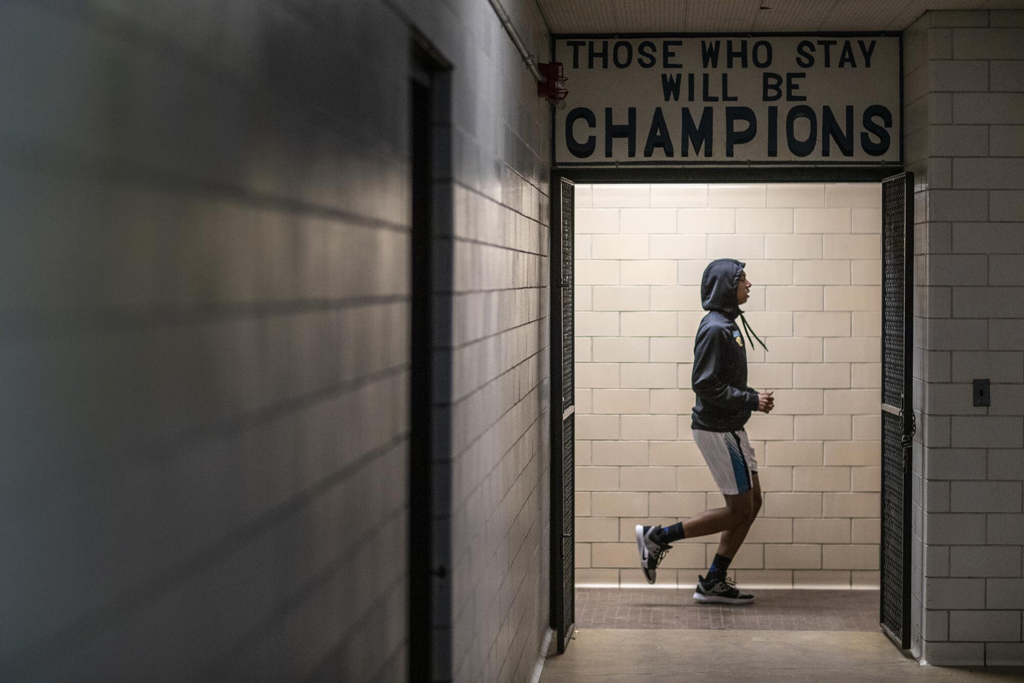 Flint High's Dion Brown warms up before a game against Beecher.