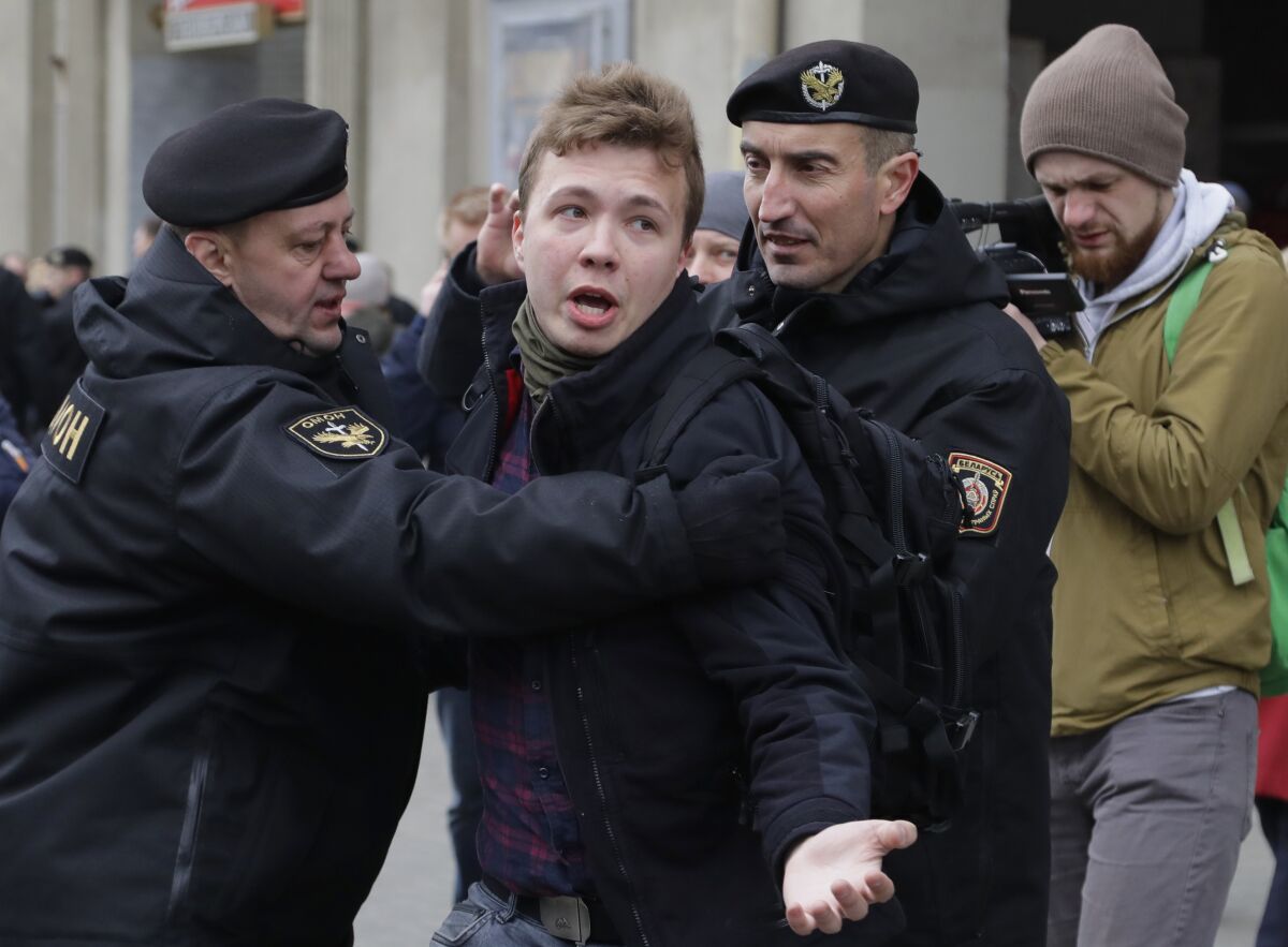 Belarus police detain journalist Roman Protasevich, center, in Minsk, Belarus, in March 26, 2017. 