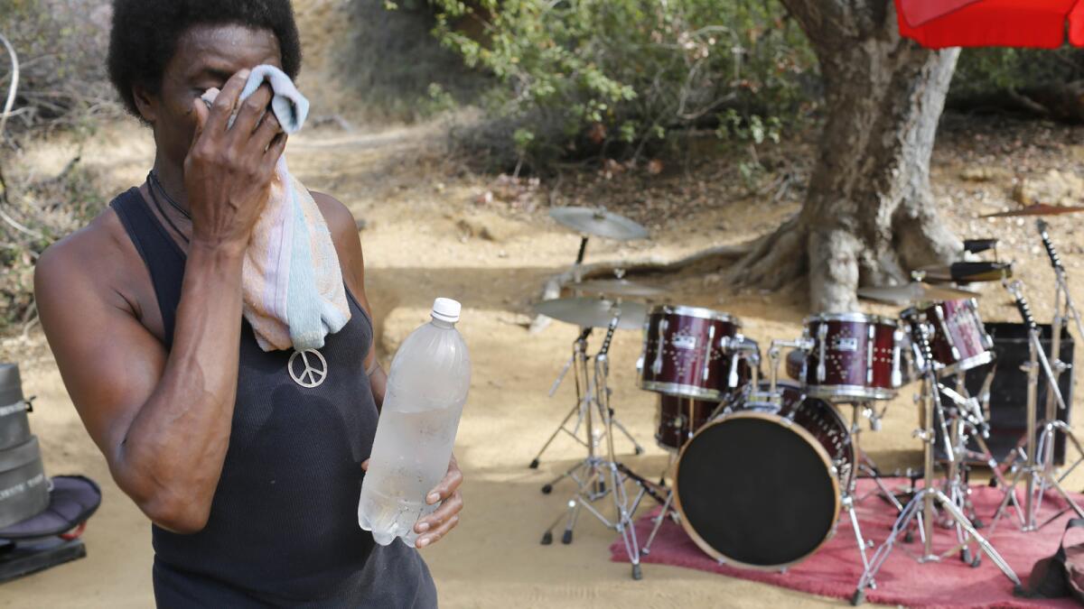 Russell takes a break during his day of drumming in Griffith Park.