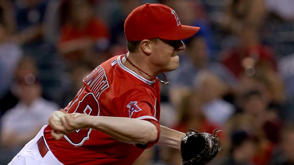 Angels reliever Joe Smith delivers a pitch during a game against the Minnesota Twins in June. Smith has played a key role in the success of the team's bullpen over the last month and a half.