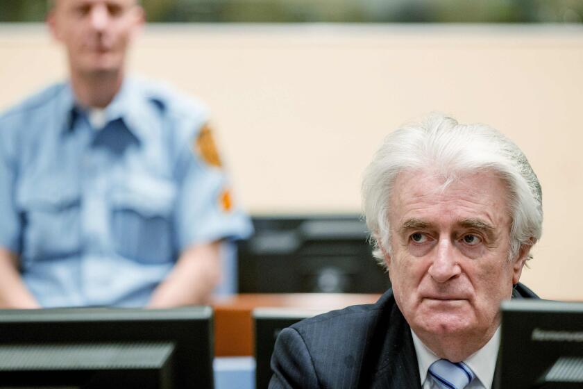 Bosnian Serb wartime leader Radovan Karadzic sits in the courtroom for the reading of his verdict at the International Criminal Tribunal for Former Yugoslavia (ICTY) in The Hague on March 24, 2016. The former Bosnian-Serbs leader is indicted for genocide, crimes against humanity, and war crimes.