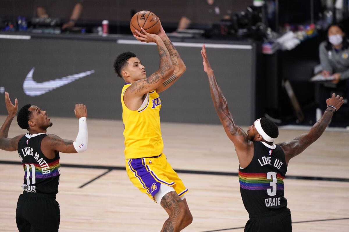 Lakers forward Kyle Kuzma gets into the lane for a floater against the Nuggets during Game 4.