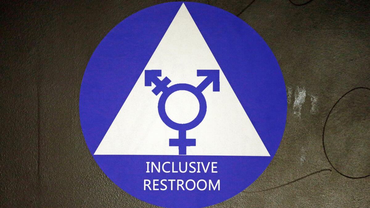 A new sticker designates a gender neutral bathroom at Nathan Hale high school in Seattle.