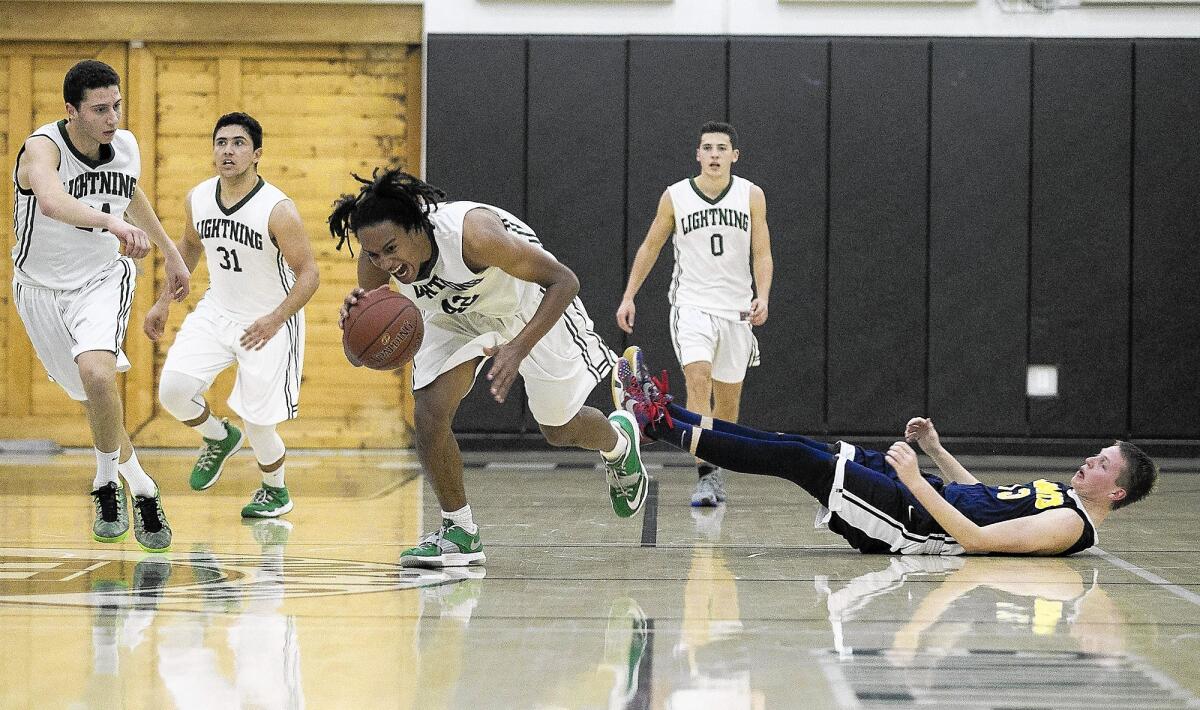 Sage Hill School's Chance Kuehnel gains possession of a loose ball during an Academy League game against Crean Lutheran on Friday.