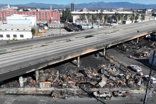 Los Angeles, CA, Sunday, November 12, 2023 - Aerial views of the 10 Freeway a day after a large pallet fire burned below, shutting the freeway to traffic. (Robert Gauthier/Los Angeles Times)