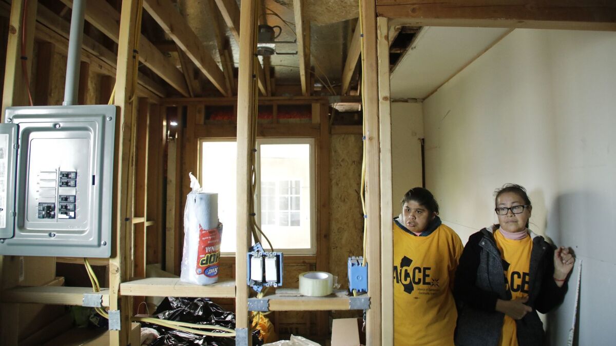 Mariela Reyes, right, hired Eco Solar Home Improvement but has incomplete work.
