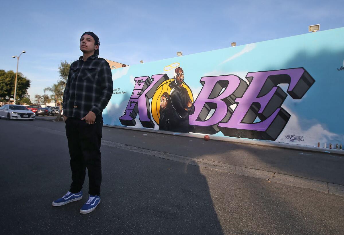 Baltazar Perdomo reflects on the mural on the side of El Toro Bravo market in Costa Mesa that honors Kobe and Gianna Bryant.