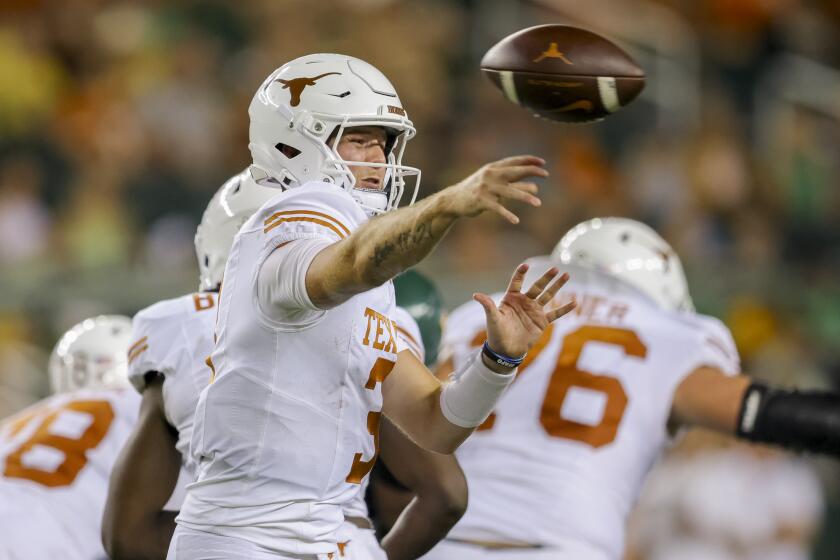 Texas quarterback Quinn Ewers throws a pass against Baylor during the second half of an NCAA college football game Saturday, Sept. 23, 2023, in Waco, Texas. (AP Photo/Gareth Patterson)