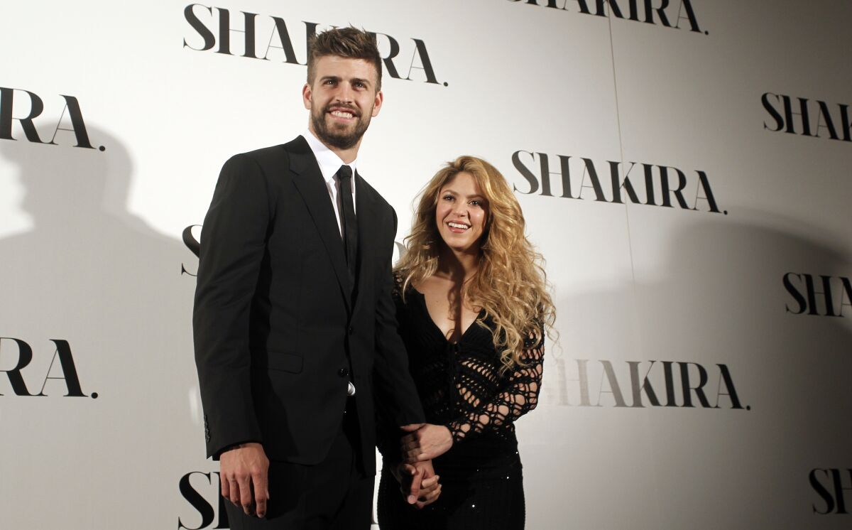 FILE - Colombian singer Shakira, right, and FC Barcelona's soccer player Gerard Pique 