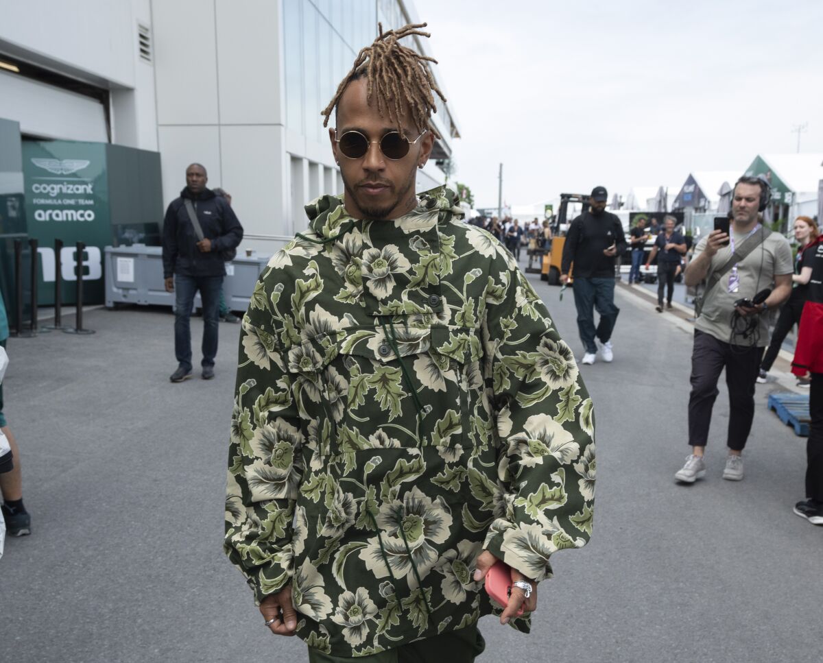 Mercedes driver Lewis Hamilton walks through the paddock at the Formula 1 Canadian Grand Prix auto race, Thursday, June 16, 2022 in Montreal. (Ryan Remiorz/The Canadian Press via AP)